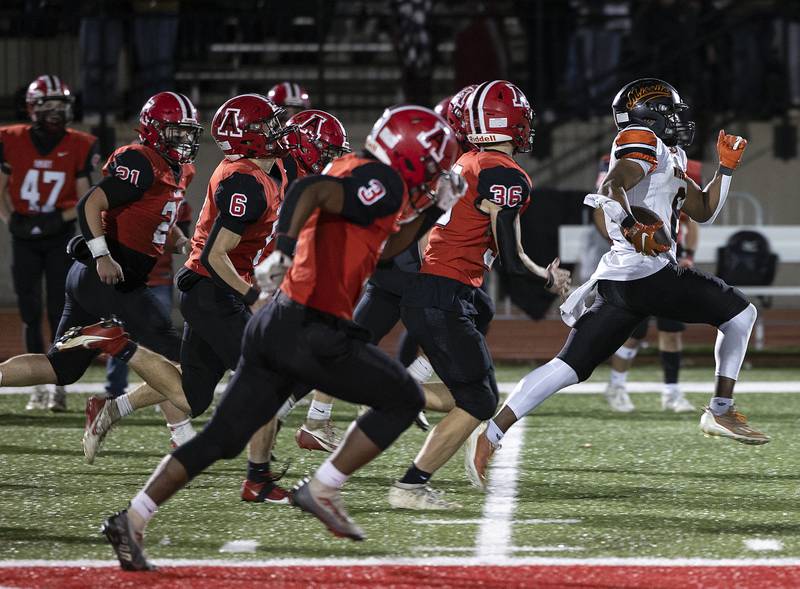 Milledgeville’s Micah Toms-Smith gets behind the Amboy defense for a big gain Friday, Nov. 22, 2024, during the 8-man football championship in Monmouth.