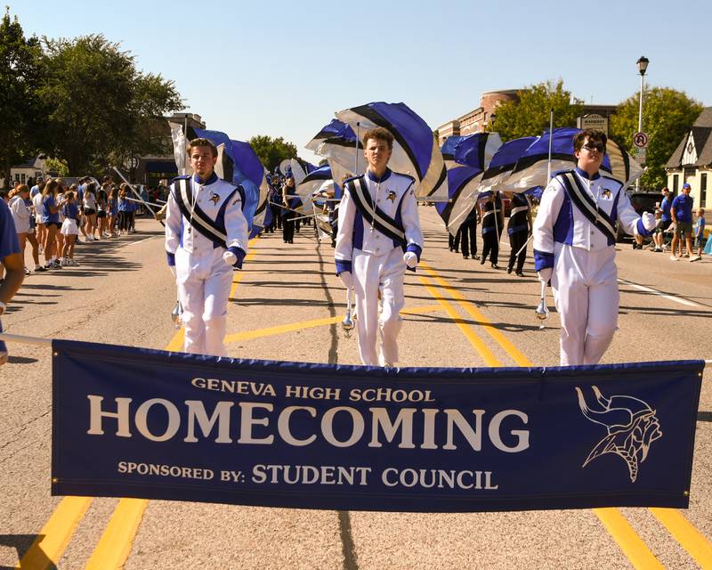 Geneva High School drum majors lead the way during the school's Homecoming Parade on Friday, Sept. 26, 2025, along State Street in downtown Geneva.