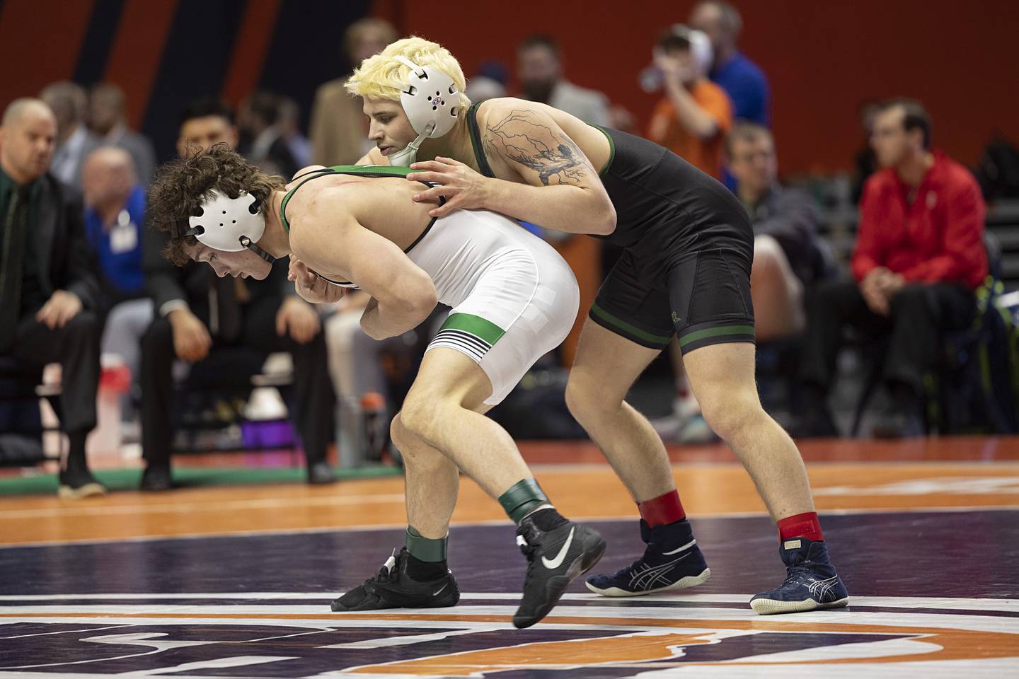 Tommy Banas (left) of Providence Catholic competes against Crystal Lake South’s Nathan Randle in the 2A 138 pound class Saturday, Feb. 21, 2026, at the IHSA wrestling finals in Champaign.
