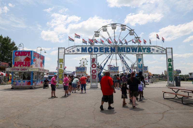 Fairgoers line up for the Modern Midways carnival opening at the Kankakee County Fair on Saturday, Aug. 2, 2025.