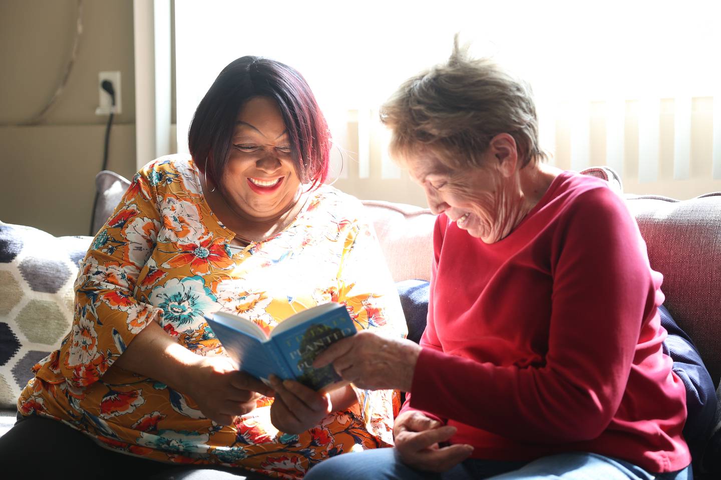 Senior Companion volunteer Karen Stromberger, left, spends time Josephine Simmons at her home in Crest Hill. Catholic Charities Senior Companion Program offers adults age 55 and older the opportunity to support and interact with their homebound peers. Wednesday, April 27, 2022, in Crest Hill.