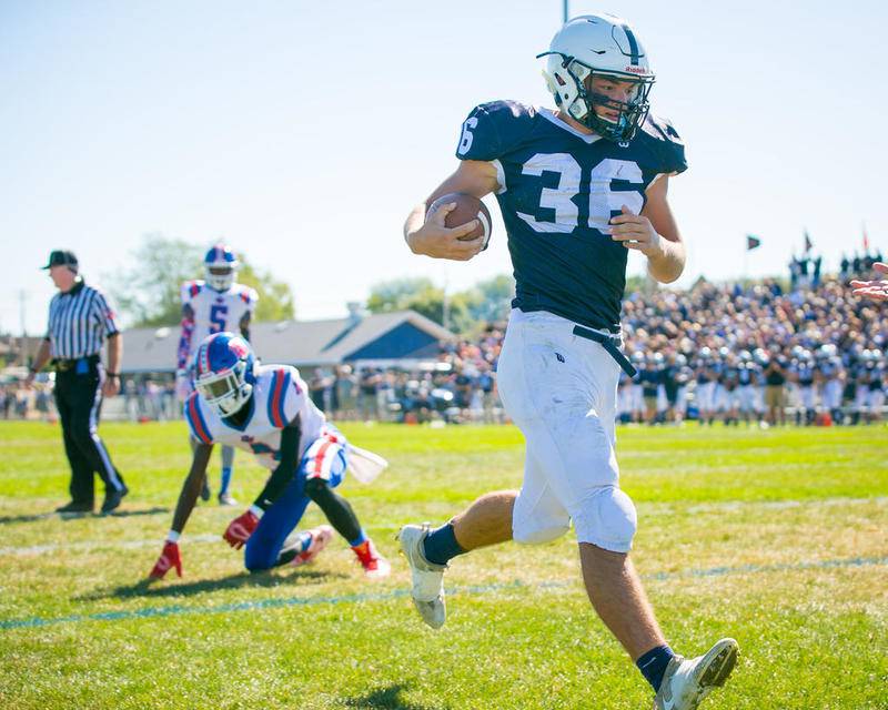 Cary-Grove fullback Max Buss (36) runs in a 13-yard touchdown last season against Dundee-Crown.