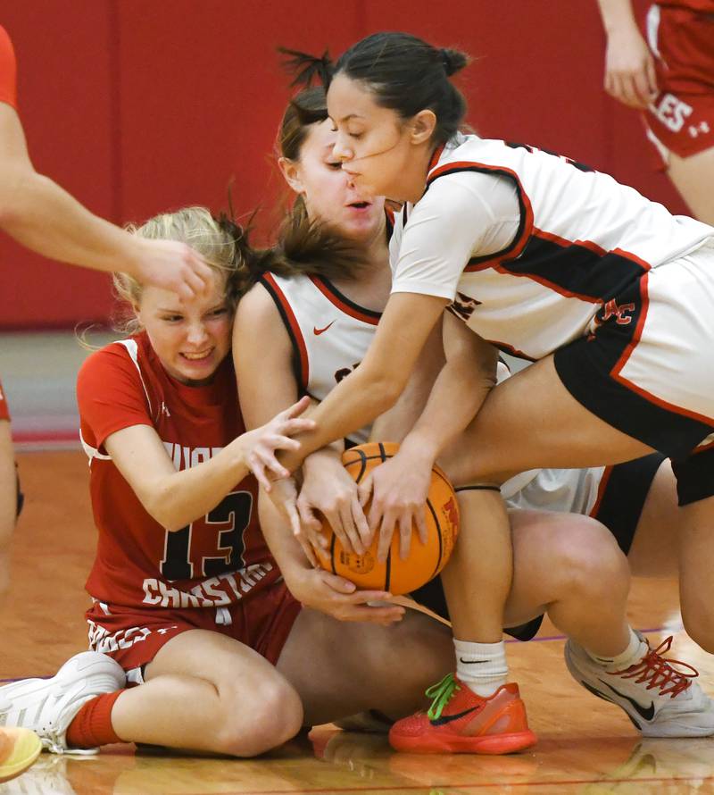 Amboy's Alexa McKendry and Leighton Gulley battle an Aurora Christian player for a loose ball at the Oregon Girls Tip-Off Tournament on Wednesday, Nov. 19, 2025 in Oregon.