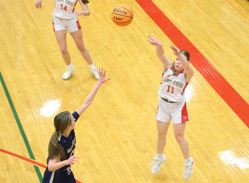 L-P's Elizabeth Sines shoots a three point jump-shot over Marquette's Kaitlyn Davis on Saturday, Jan. 4, 2025 in Sellett Gymnasium at L-P High School.