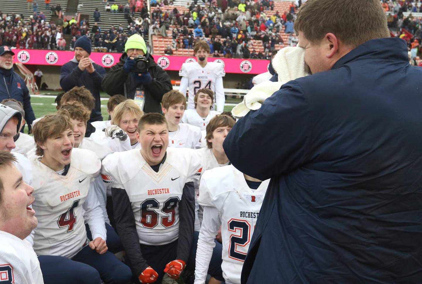 Rochester head coach Derek Leonard gets emotional as he talks to his players after their Class 5A state football championship victory over St. Rita Saturday in Huskie Stadium at Northern Illinois University.