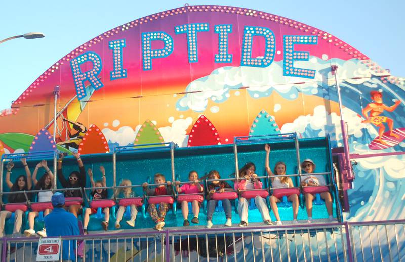 Riptide riders throw their hands in the air Friday, May 26, 2023, at Park Fest in downtown Streator.