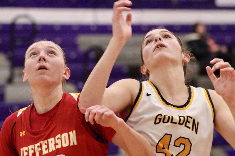Rockford Jefferson's Abigail Bracius (33) and Sterling's Madison Austin (42) jostle for rebound position on Wednesday during the Dixon KSB Holiday Classic. Jefferson won 41-37.