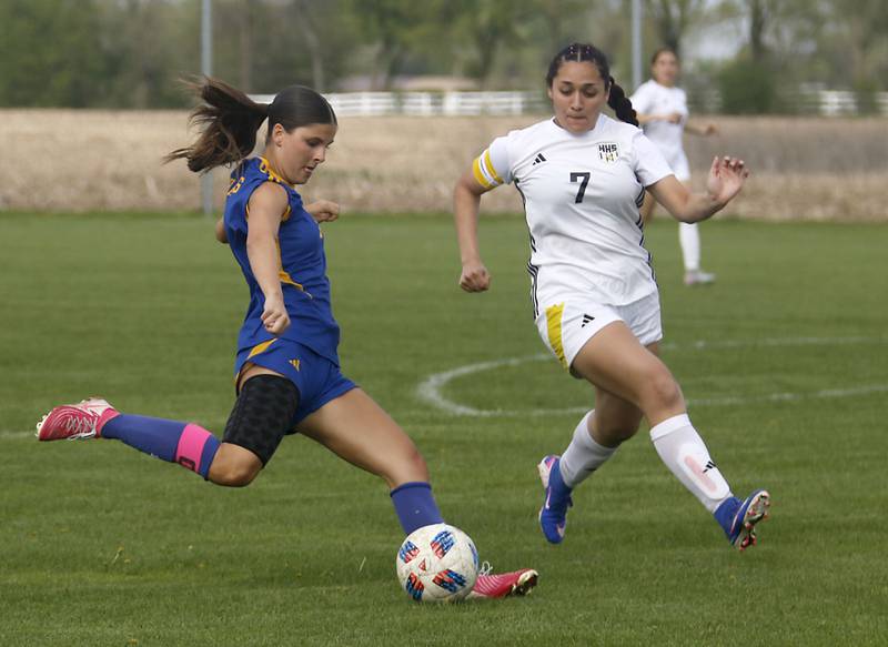 Johnsburg's Elizabeth Smith takes a shot on goal as Harvard's Ithandehui Rosas defends during a Kishwaukee River Conference soccer match on Wednesday, April 27, 2026, at Johnsburg High School.