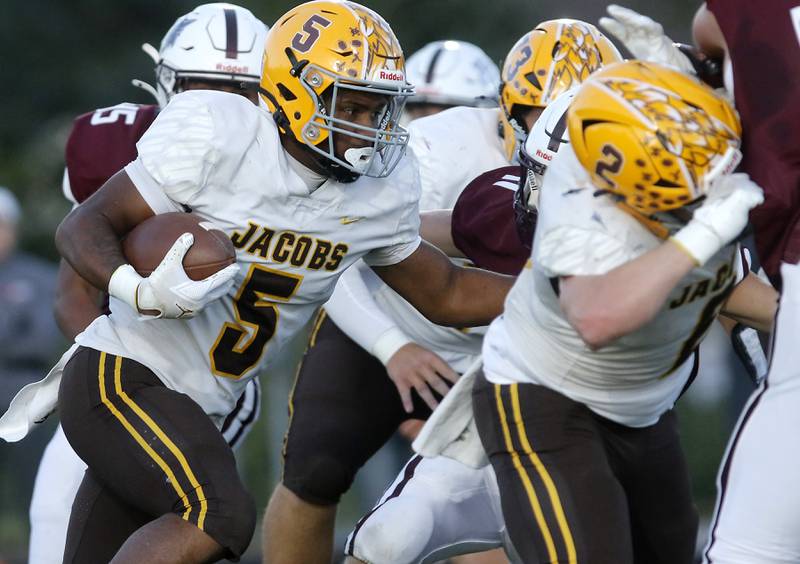 Jacobs' Michael Cannady runs with the ball during a Fox Valley Conference football game Prairie Ridge on Friday, Sept. 5, 2025, at Prairie Ridge High School in Crystal Lake.