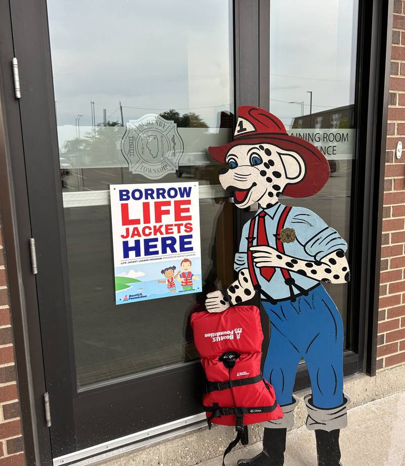 A cutout mascot holds one of the life vests available for residents to borrow at the McHenry Township Fire Protection District station at 3610 W. Elm St., McHenry.