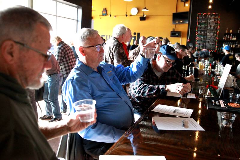 (From left) Dan Young of Batavia, John O’Sullivan of Carpentersvilla nd Chris Olson of Aurora judge water from throughout Kane County in a blind taste test on Thursday, Dec. 19, 2024 during the annual Kane County Water Association's annual water tasting contest at Global Brew in St. Charles.
