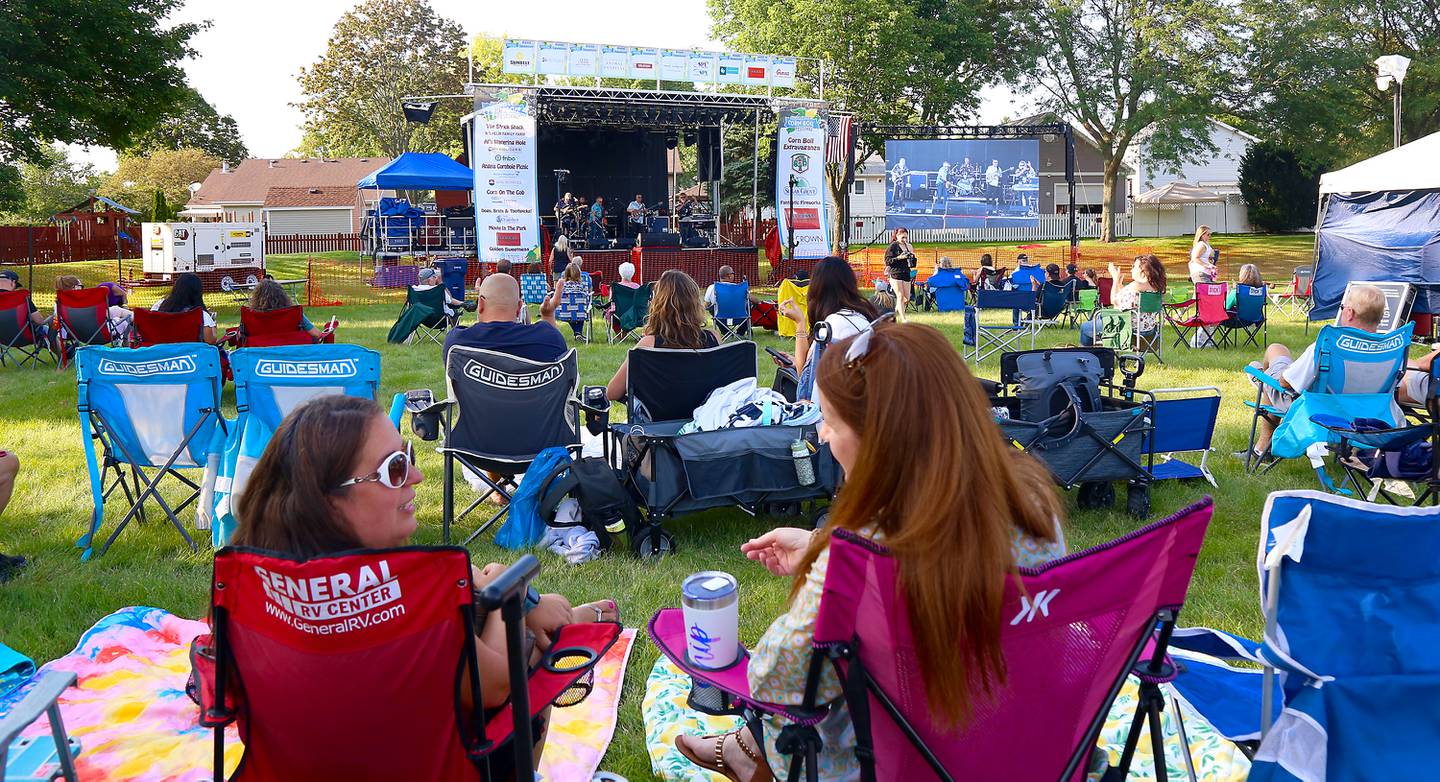 People listen to Strung Out Chicago at the 2024 Sugar Grove Corn Boil on Friday, July 26, 2024.