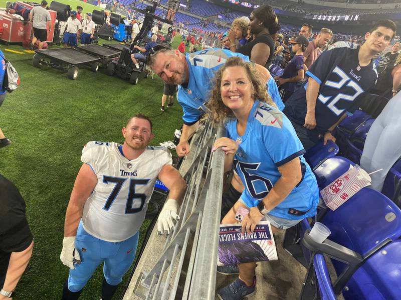 Former McHenry offensive lineman Andrew Rupcich with his father William and stepmother Bernadette at a Tennessee Titans' preseason game.