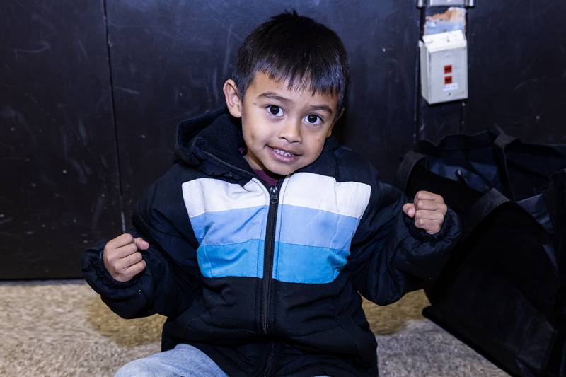 Emmanuel Long feels strong in a new winter coat from Nicor Gas, in collaboration with Operation Warm, at T. E. Culbertson Elementary School on Nov. 7, 2025.