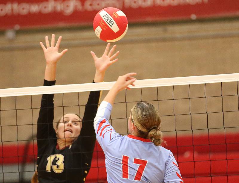 Morris's Ava Smith misses a spike from Ottawa's Olivia Evola on Tuesday, Sept. 12, 2023 in Kingman Gym at Ottawa High School.