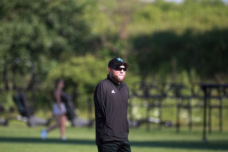 Woodstock North Head Coach Jeremiah Homuth looks on during a 7 on 7 football tournament on Tuesday, July 15, 2025 at Kaneland High School in Maple Park.