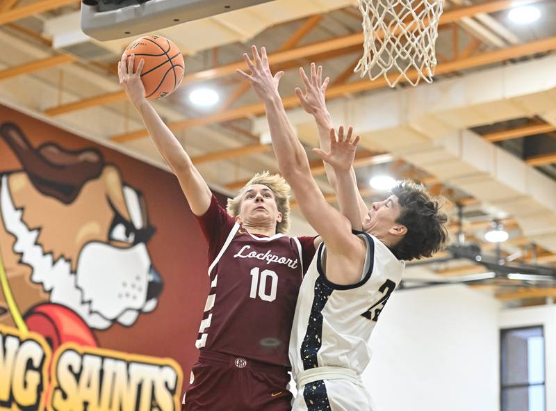 Lockport's Nojus Venckus goes up strong for a shot during the WJOL tournament championship game against Lemont on Saturday, NOV. 29, 2025, at Joliet.
