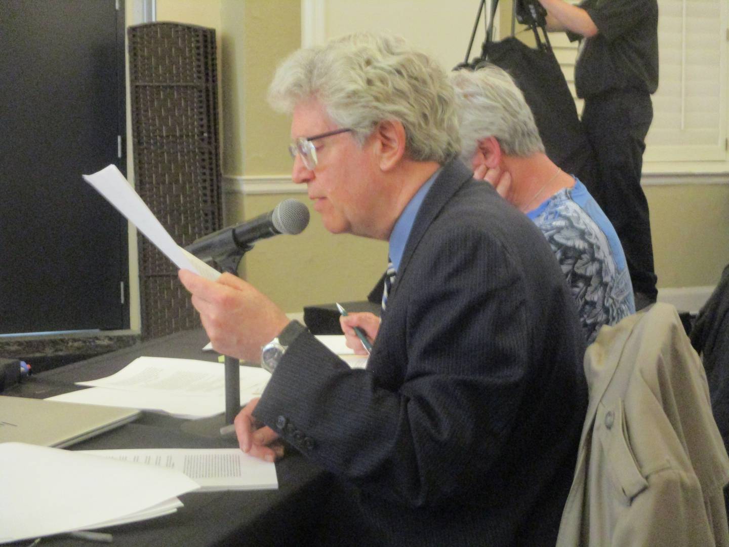 Attorney Steven Becker asks questions during a public hearing held Tuesday by the Will County Planning and Zoning Commission on Earthrise Energy's plan for a 6,100-acre solar complex at the Renaissance Center in Joliet. May 12, 2026