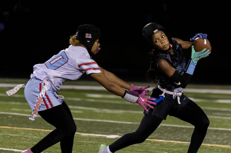 Willowbrooks's Janell Adams dodges the defense during a varsity flag football IHSA State Quarterfinals game against Kenwood, held at Willowbrook High School on Oct. 17, 2025.