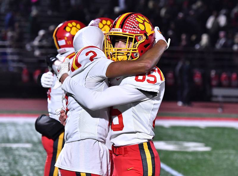 Batavia's Isaiah Brown (2) and Tyler Humbert celebrate after defeating Lincoln-Way Central during the Class 7A semifinal playoff game on Saturday, Nov 23, 2024 at New Lenox. (Dean Reid for Shaw Local News)