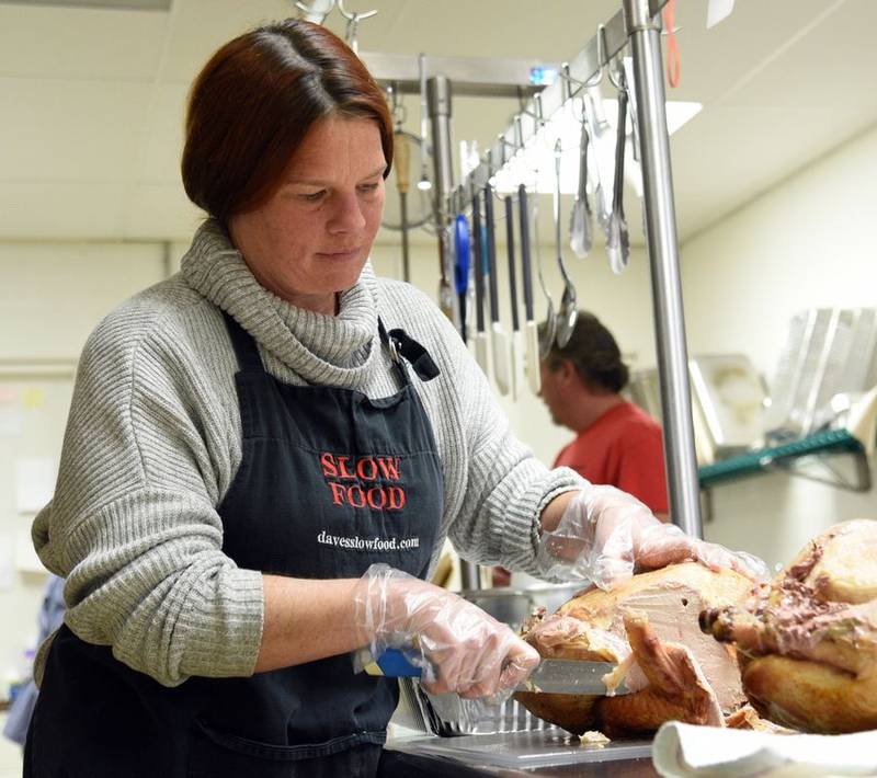 Caterer Quenby Schuyler prepares meals that will be served in the substance-abuse recovery pod at the Kane County jail today for Thanksgiving. Schuyler and many of her volunteers are also in recovery.