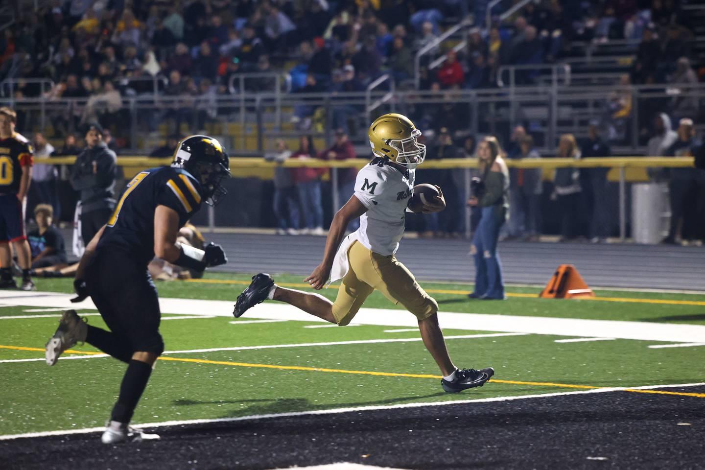 Bishop McNamara's Micah Lee runs in a touchdown during the Fightin' Irish's 45-28 victory over Herscher on Friday, Sept. 5, 2025.