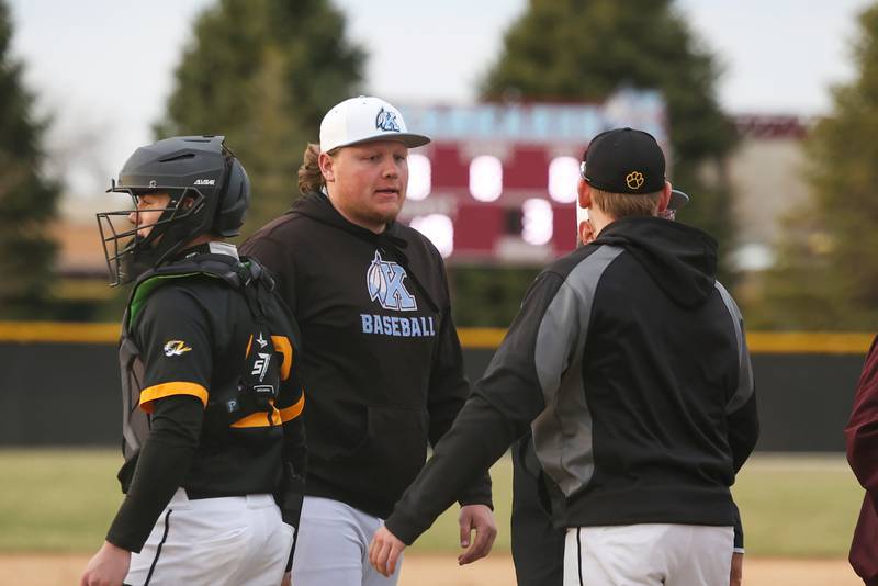Kankakee High School baseball head coach Nick Crowe shakes hands with Herscher players after the game Friday, March 21.