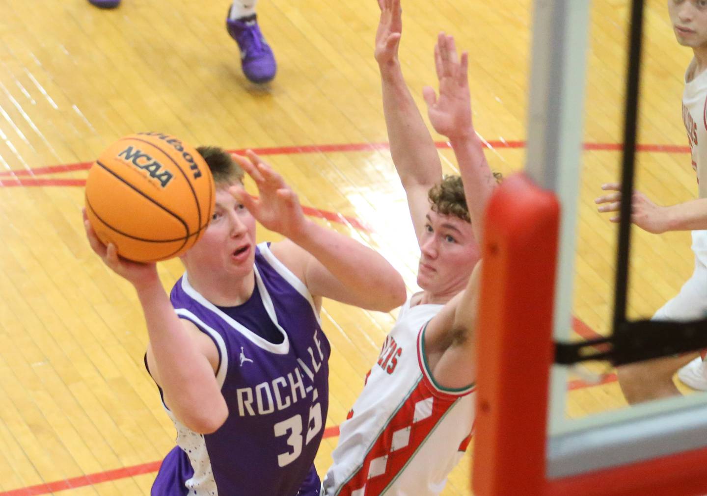 Rochelle's Eli Schweitzer eyes the hoop over L-P's Regan Doerr on Friday, Feb. 13, 2026 in Sellett Gymnasium at L-P High School.