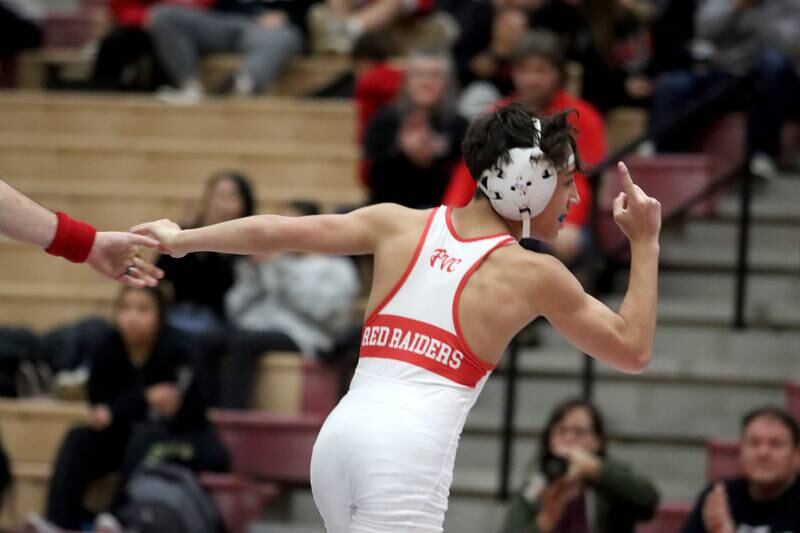 Huntley’s Colin Abordo celebrates a win over Crystal Lake Central’s Jackson Marlette at 116 pounds in varsity wrestling on Friday, Dec. 13, 2024 at Huntley High School in Huntley.