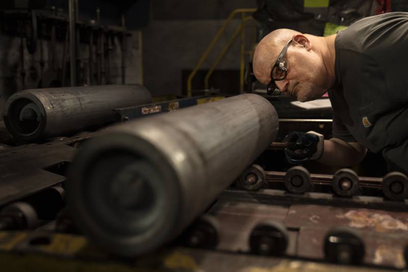 File - A steel worker inspects a 155 mm M795 artillery projectile during the manufacturing process at the Scranton Army Ammunition Plant in Scranton, Pa., Thursday, April 13, 2023. On Thursday, the Commerce Department issues its first of three estimates of how the U.S. economy performed in the first quarter of 2023. (AP Photo/Matt Rourke, File)