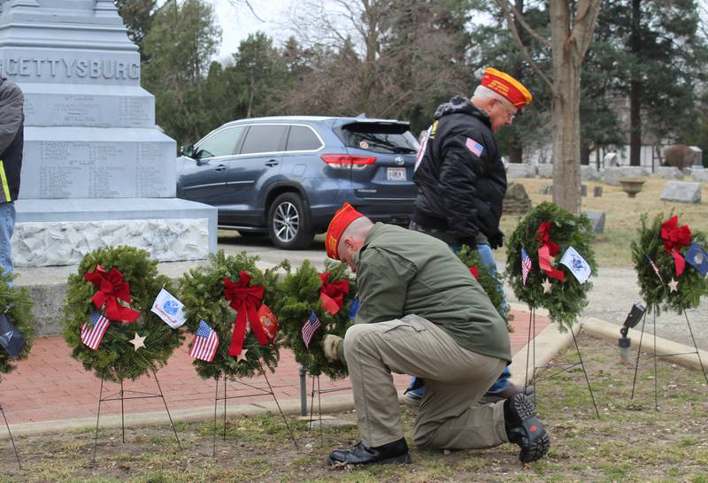 American Legion members place wreaths representing the branches of the U.S. military at Union Cemetery on Dec. 14, 2024, in Crystal Lake during the Wreaths Across America ceremony.