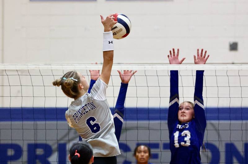 Princeton senior Keely Lawson hits against Newman's Kennedi Shippert Tuesday night at Prouty Gym. The Tigresses won 2-0.