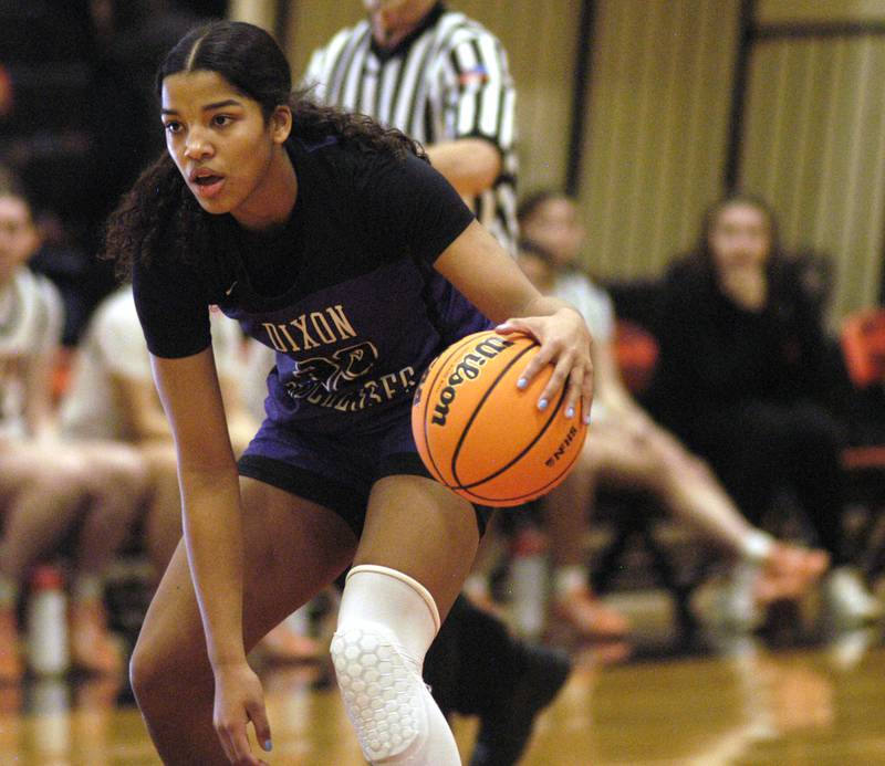 Dixon's Ahmyrie McGowan brings the ball upcourt.. The Byron Tigers won over the Dixon Duchesses 46-43 in overtime. The girls basketball game took place at Byron on Saturday, January 24th, 2026