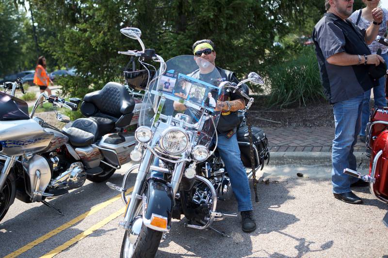 Bike rider Marlon "Taz" Ortega from Lana Windfield at the 9th Annual Ride for John has photos for my child's life matters on Saturday Aug.2, 2025 in Carol Stream.