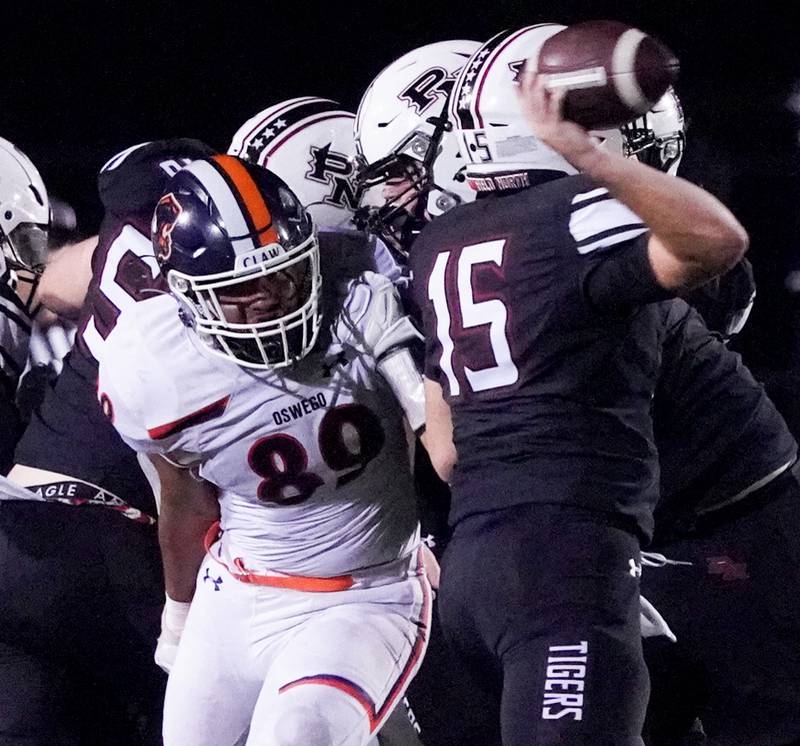 Oswego’s Taiden Thomas (89) rushes Plainfield North's Nicholas Darwish (15) during a football game at Plainfield North High School on Friday, Sept. 22, 2023.