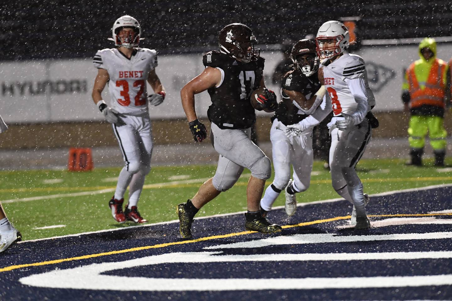 Joliet Catholic's Hunter Powell runs in a touchdown during a game against Benet Friday Oct. 14, 2022 at Joliet Memorial Stadium