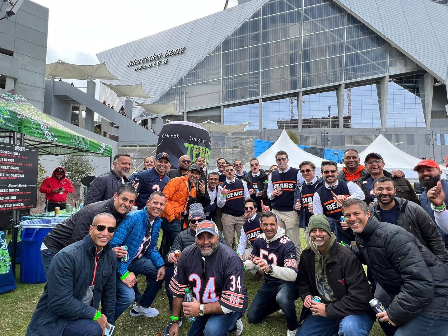 Members of St. Charles East alum Jake Mazanke's bachelor party dressed as former Bears coach Mike Ditka to attend the Atlanta Falcons-Chicago Bears game on Nov. 20, 2022. The group posed for pictures with fans outside the stadium.