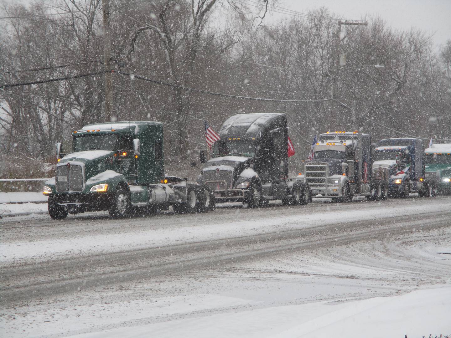 A truck pilgrimage from Joliet moves along Route 53 near Theodore Street on Saturday morning. Nov. 29, 2025