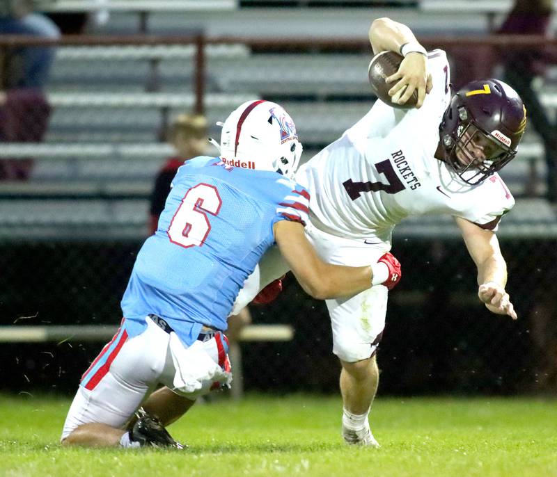 Richmond-Burton’s Blake Livdahl, right, is brought down by Marian Central’s Josh Gawronski  in varsity football at George Harding Field on the campus of Marian Central High School in Woodstock on Friday, August 29, 2025.