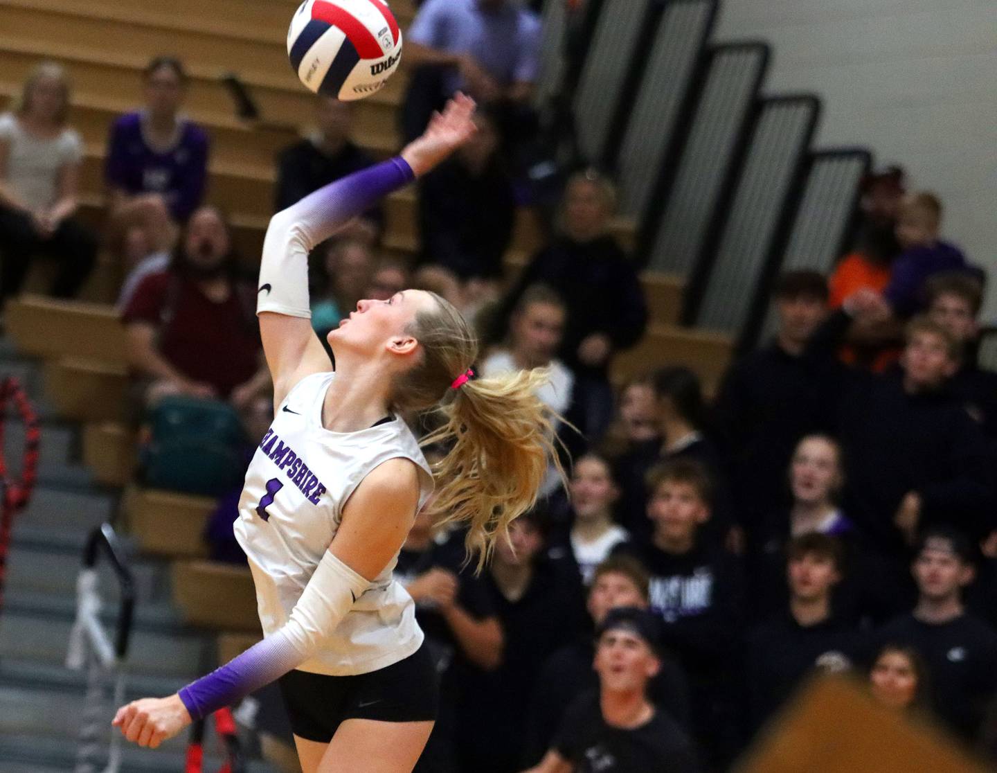Hampshire’s Elizabeth King hammers the ball in girls varsity volleyball at Huntley High School on Thursday, October 23, 2025.