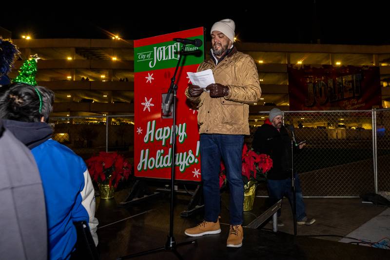 Joliet City Center Partnership Executive Director Emmanuel Lopez welcomes everyone to the Light Up the Holidays Tree Lighting Ceremony at Joliet’s City Square on Nov. 28, 2025.