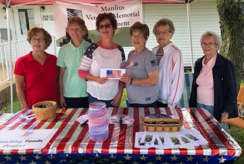(L-R) Nancy Hartz, Helen Hardesty, Patti Hedrick, Lois Swanson, Joanne Nelson and Ruth DeBolt. Swanson is presented the check to Hedrick on behalf of the Veterans Memorial Monument fund.