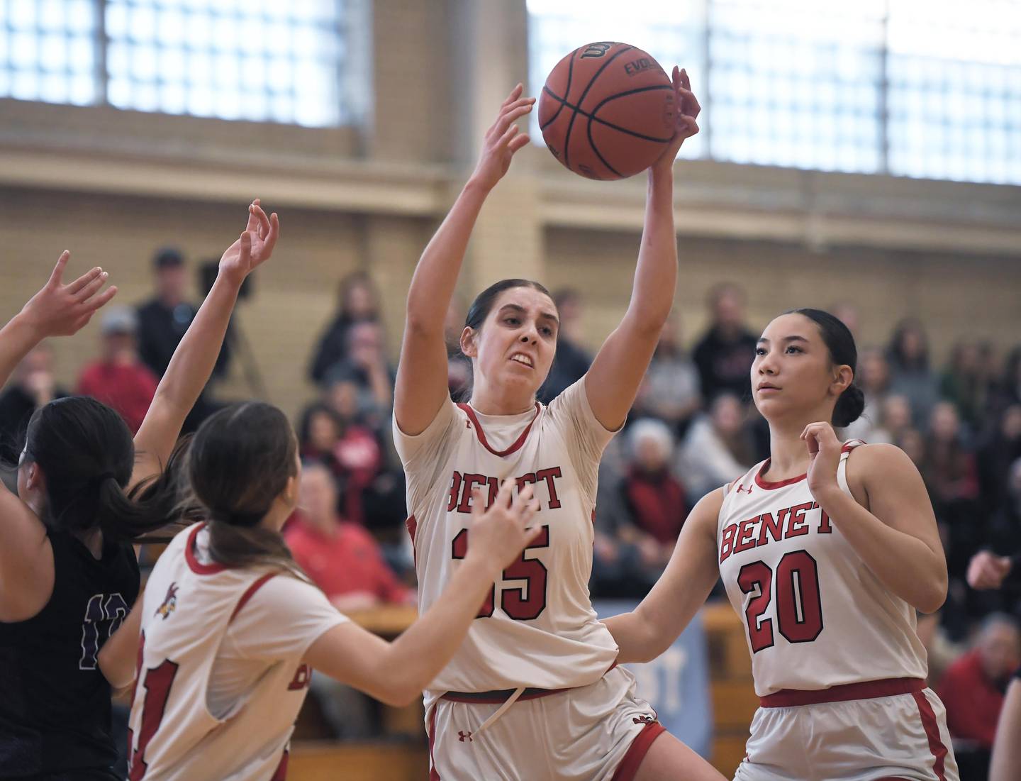 Benet Academy’s Emilia Sularski gets a rebound against Rolling Meadows in the 34th Annual coach Derril Kipp’s Hoopsfest at Benet Academy in Lisle on Monday, January 15, 2024.