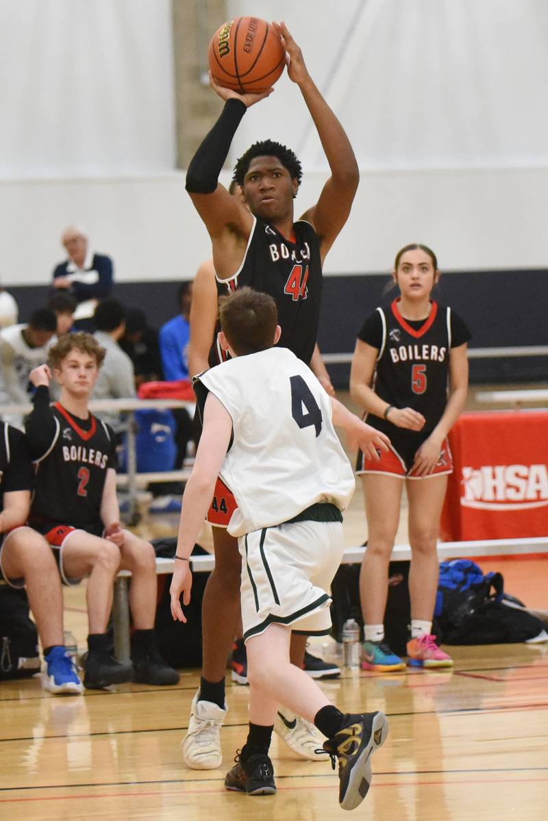 Bradley-Bourbonnais' Jeremiah Jones shoots a 3-pointer as Vaughn/St. Patrick's Chewy Nee closes out during the IHSA Class 2A Special Olympics Unified State championship at the University of Illinois Activities and Recreation Center Saturday, March 14, 2026.