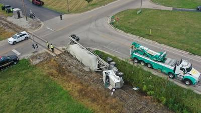 Photos: Sand hauler semi truck overturns on Ottawa's west side