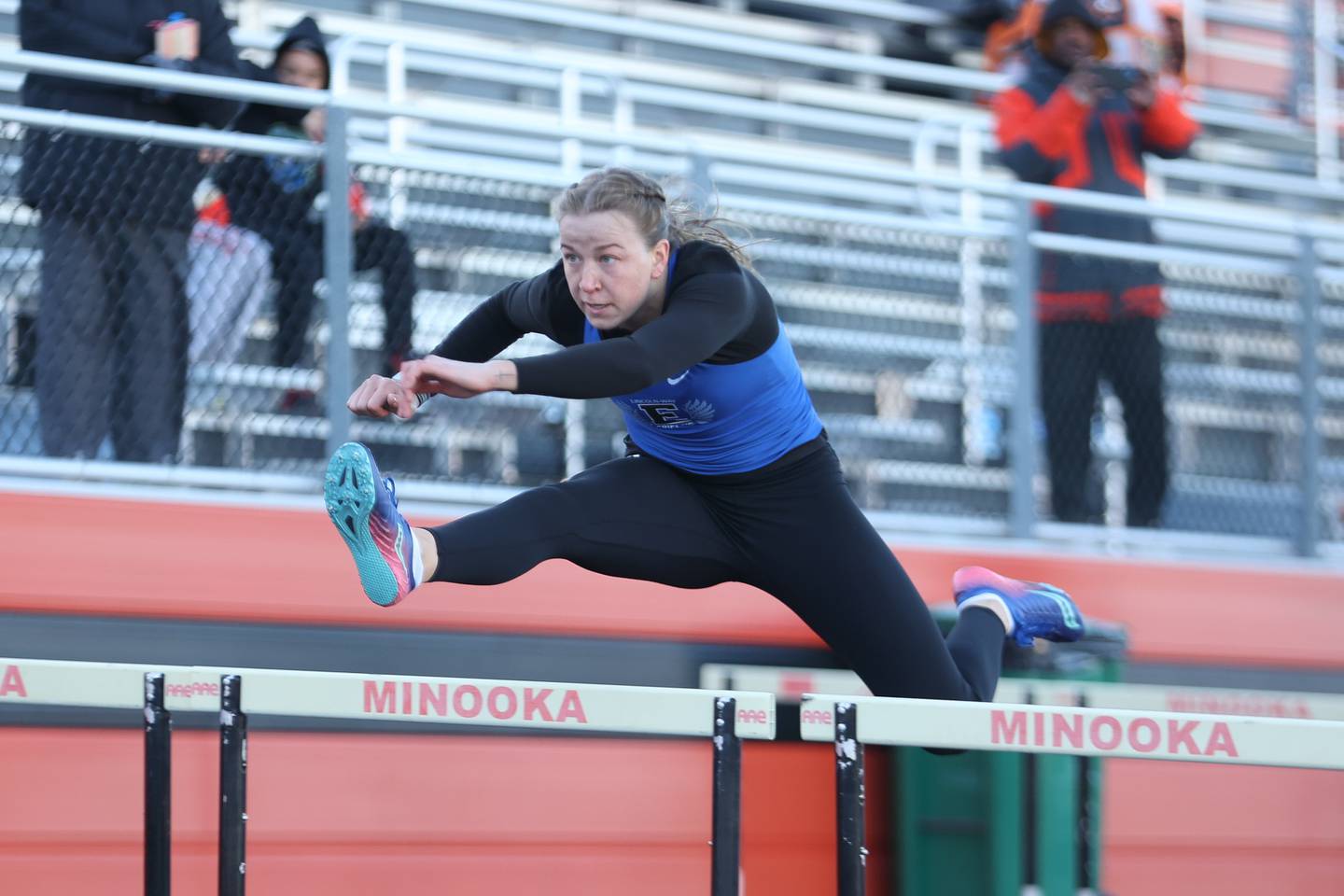 Lincoln-Way East’s Sophia Barnard took first in the 100 meter hurdles with a time of 16.06 at the Minooka track invitational. Thursday, April 14, 2022, in Minooka.