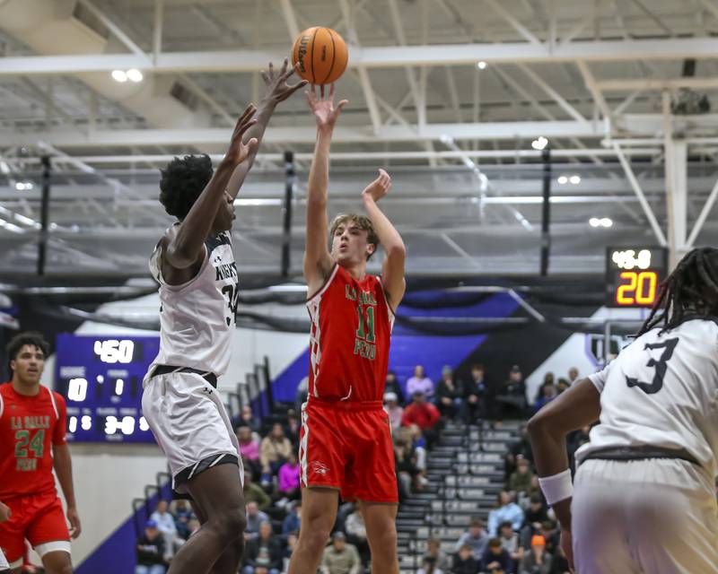 LaSalle Peru's Jameson Hill (11) shoots a jump shot during their Plano Christmas Classic semi-final basketball game between Kaneland at LaSalle Peru Monday, Dec 29, 2025 in Plano.