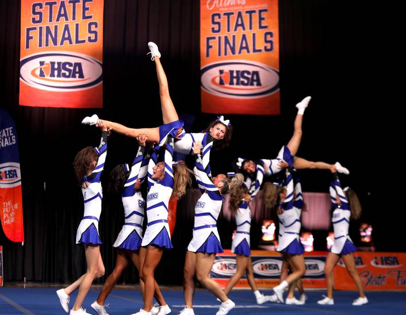 Members of the St. Francis cheerleading team compete in the small team division of the IHSA State Finals on Saturday, Feb. 8, 2025 at Grossinger Motors Arena in Bloomington.