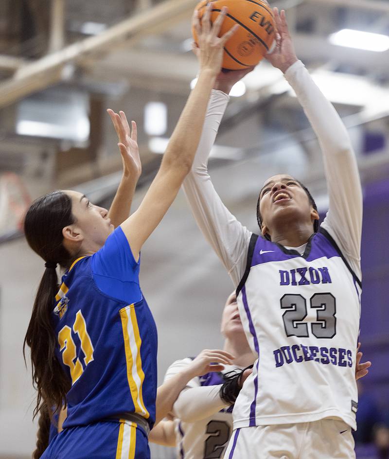 Dixon's Ahmyrie McGowan has a shot blocked by Aurora Central’s Sofia Orozco Thursday, Dec. 26, 2024, during the Dixon Girl’s KSB Holiday Basketball Classic.