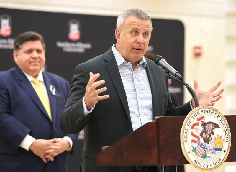 DeKalb Mayor Cohen Barnes speaks as Illinois Gov. JB Pritzker looks on Thursday, March 3, 2022, in the Barsema Alumni and Visitors Center at Northern Illinois University in DeKalb. Pritzker was visiting NIU to talk about the importance of higher education and to tout the programs in Illinois that make that education more accessible to all.